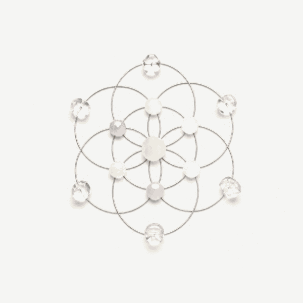 Onna crystal grid with clear and white crystals for abundance and positivity.