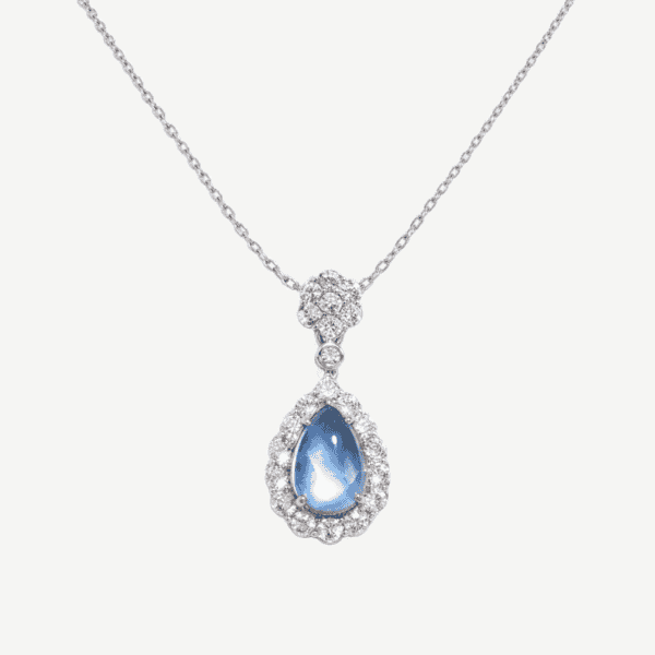 Stunning silver necklace with teardrop blue crystal pendant and sparkling accents.