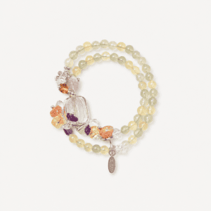 Elegant moonstone and clear quartz beaded bracelet with charms.