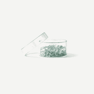 Green fluorite focus stone chips in a clear container on white background.