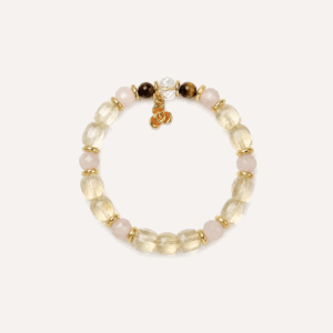 Elegant crystal bow bracelet with pearls and gold accents for jewelry lovers.