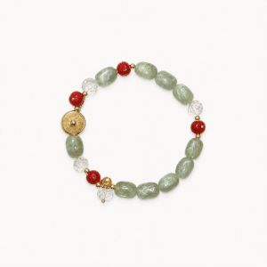 Elegant bracelet with green crystal, red agate, and gold accents from Onna.