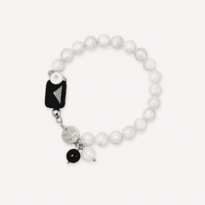 Elegant white and black crystal bracelet with charms for wellness.